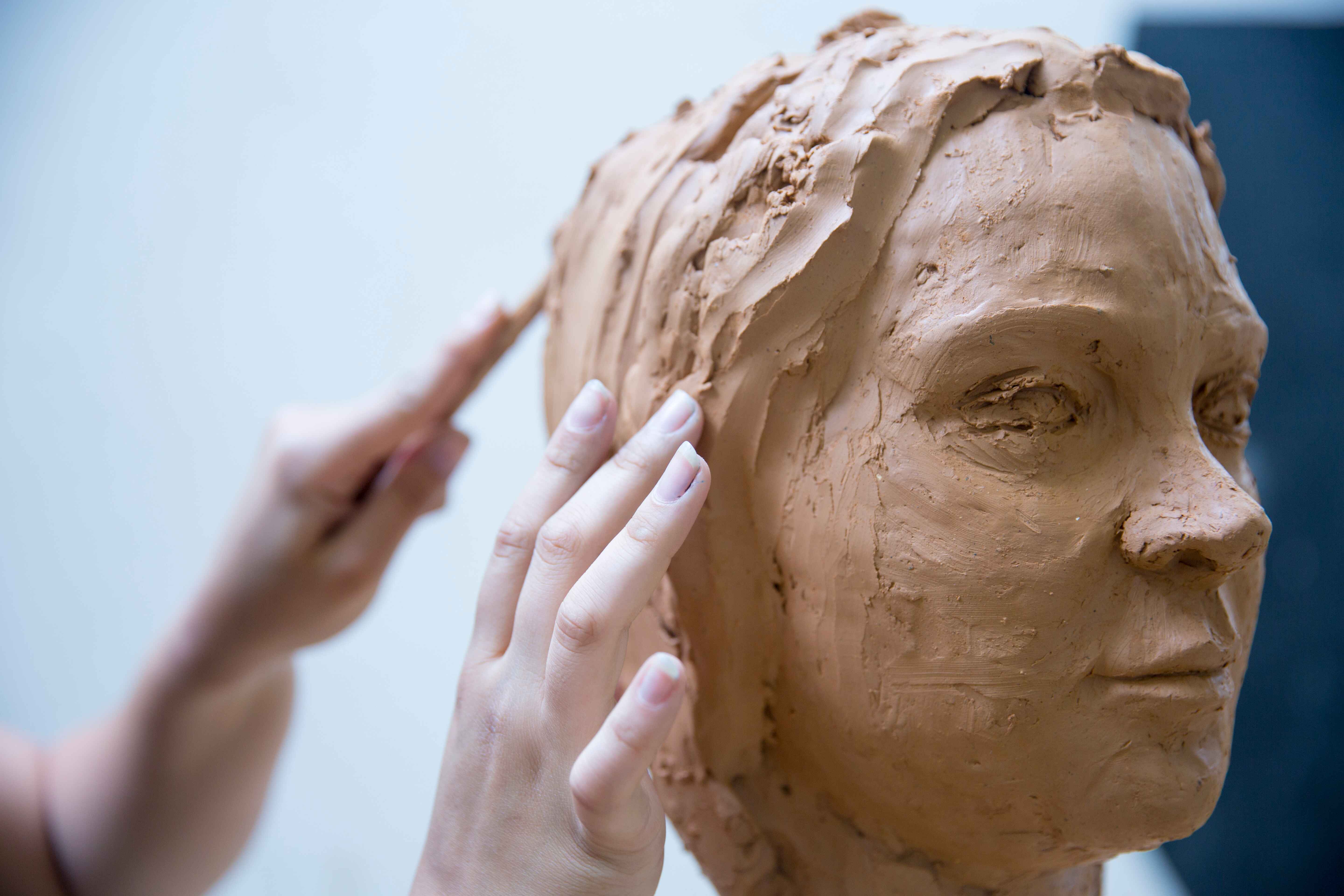 Artist creating a sculpture