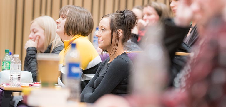 students sitting in a lecture theatre