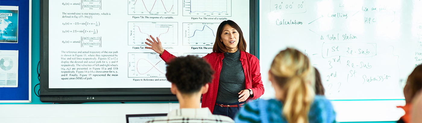 Secondary teacher teaching a class of students
