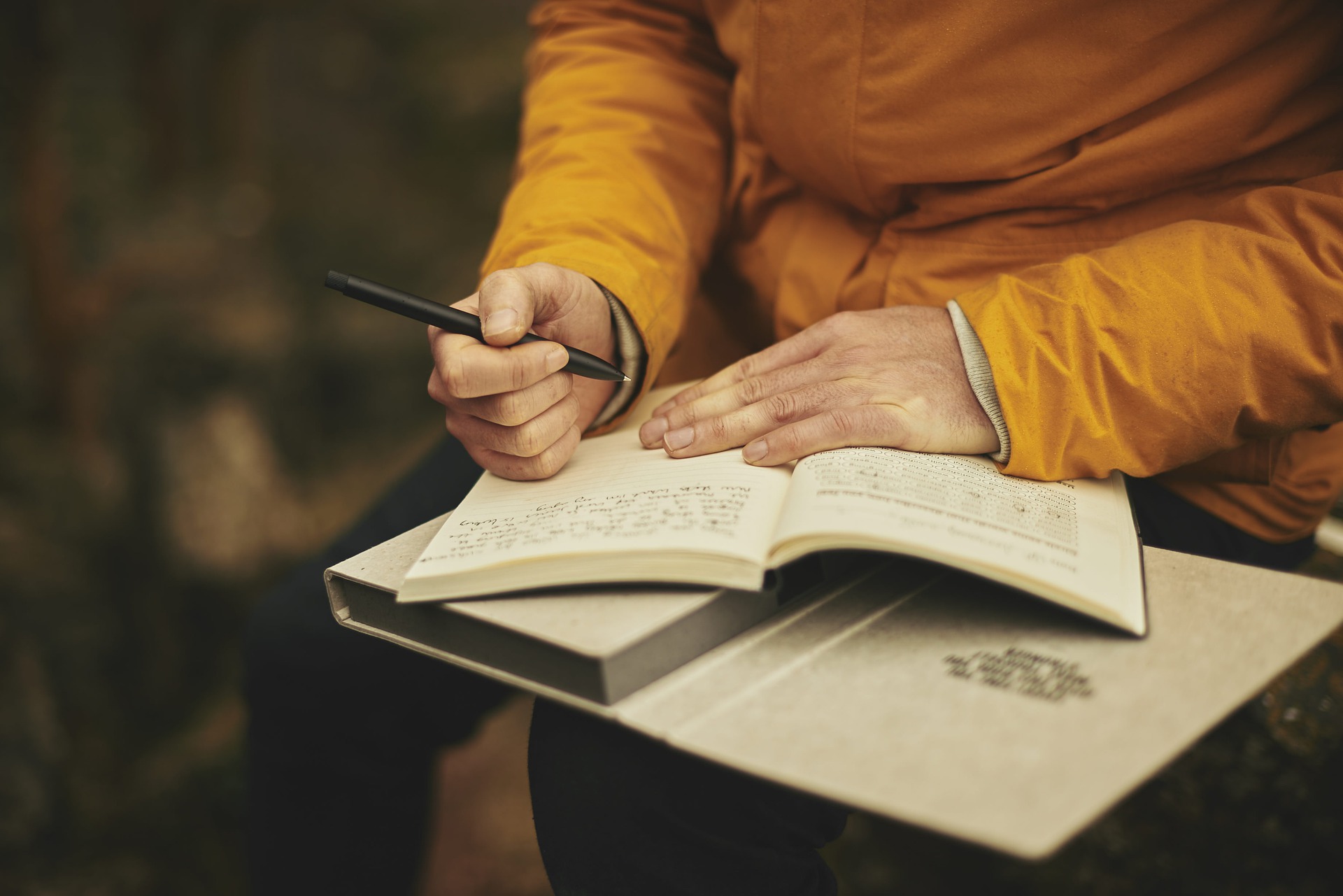 A person writing in a book