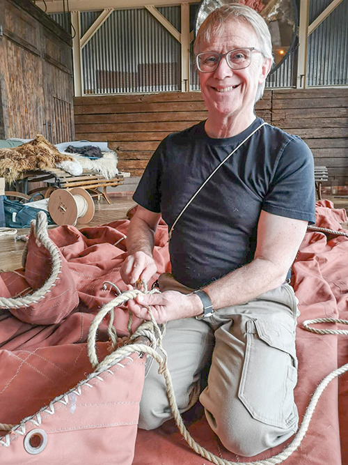 Mark Shiner making sails in his workshop