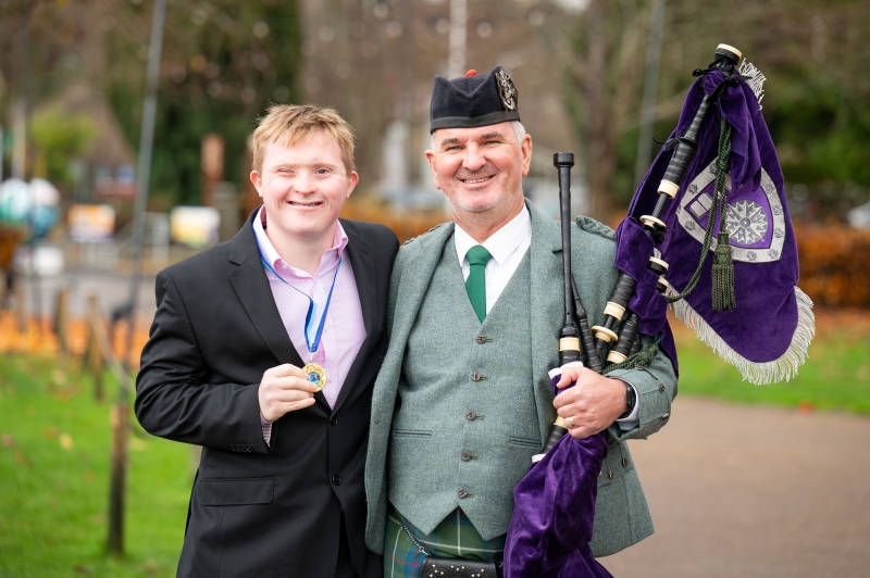 Matthew McCreadie, Half Blue winner. Pictured with DJ MacIntyre, UHI's Gaelic Officer, and the bagpiper during the day's events