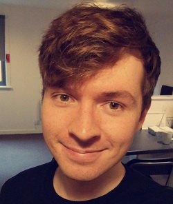 Close-up portrait of a man smiling at the camera