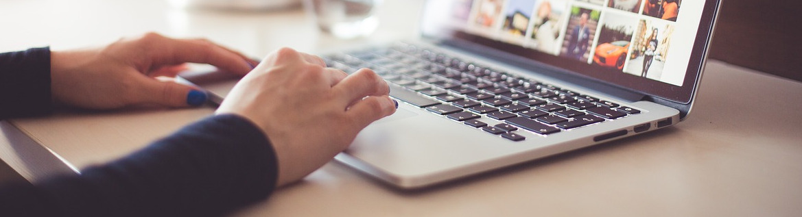 Hands on laptop keyboard