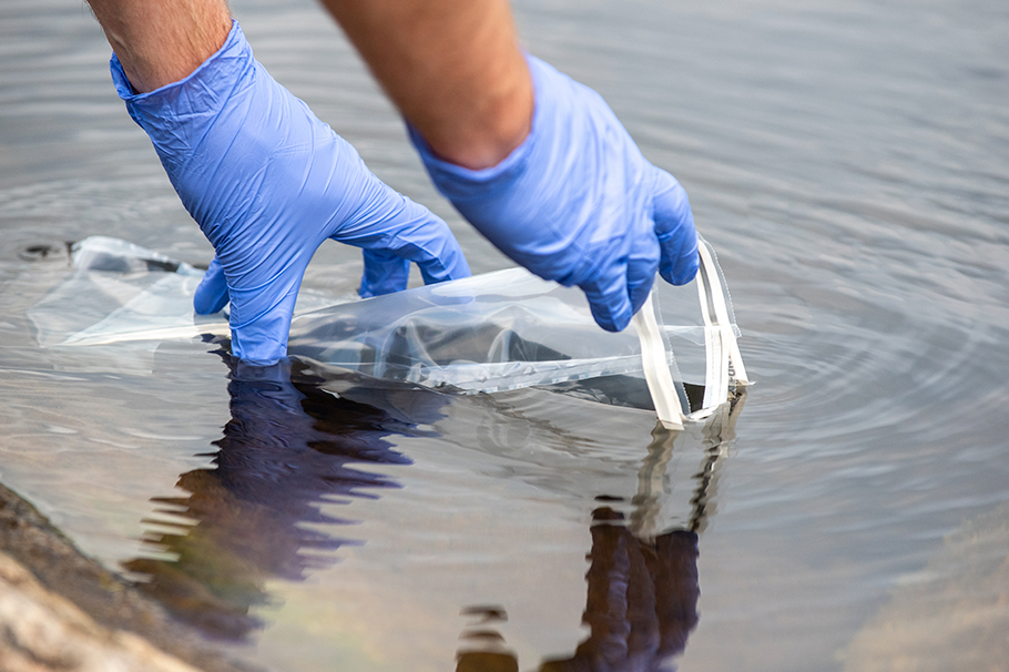 Person taking a water sample