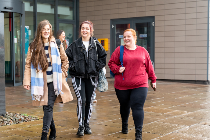 Students walking outside UHI House